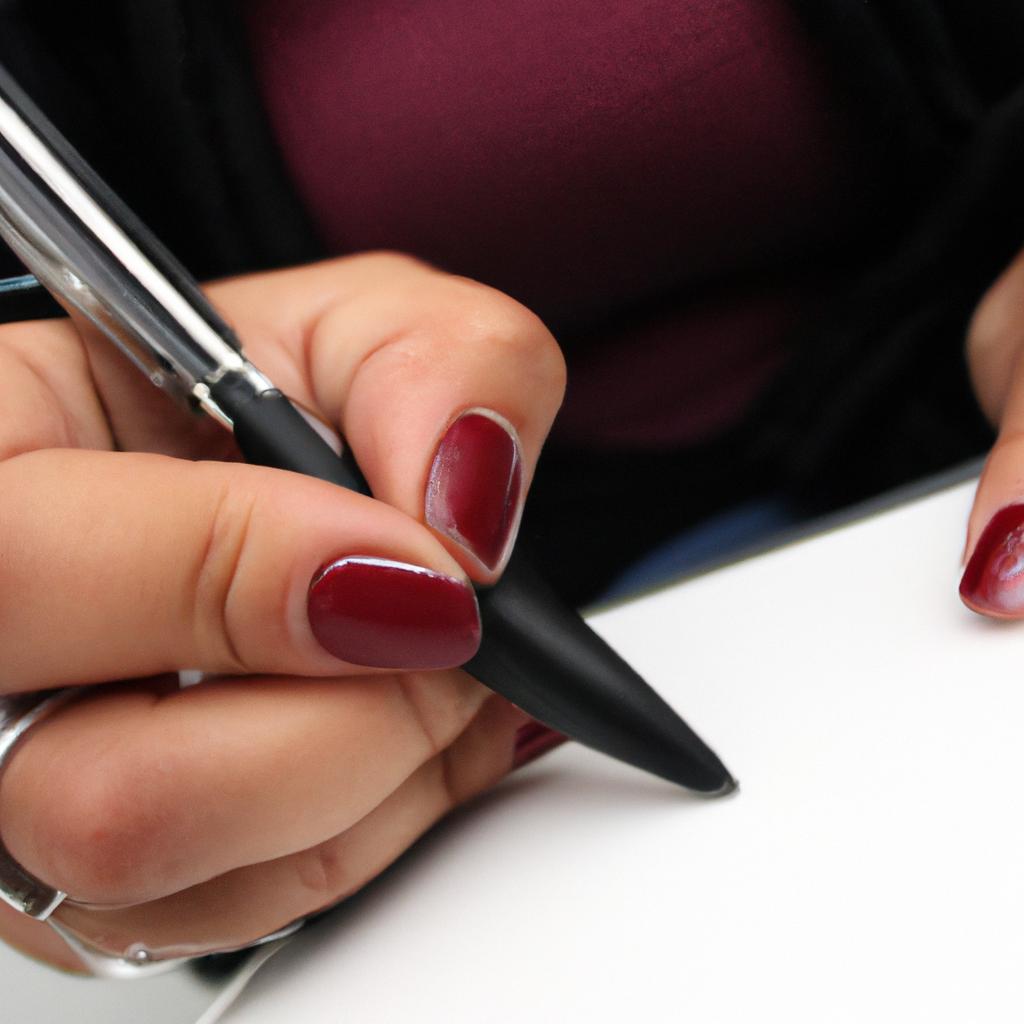 Woman holding a pen, writing